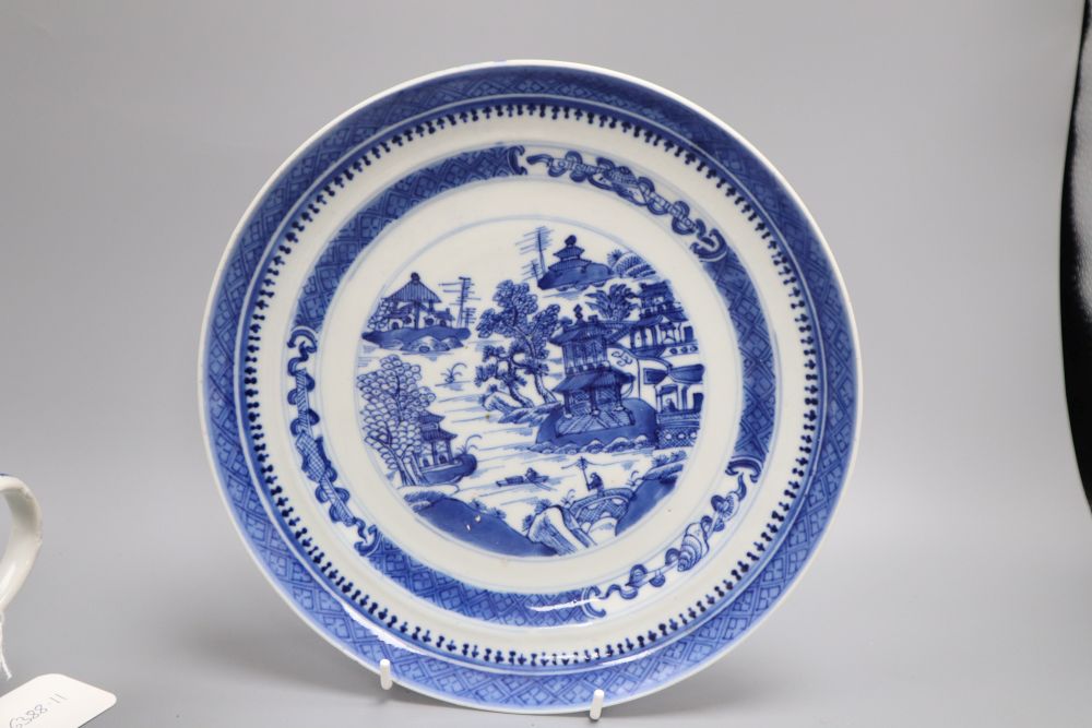 Five pieces of Chinese ceramics including two blue and white plates, a Canton plate, a blue and white mug and a prunus jar and cover,